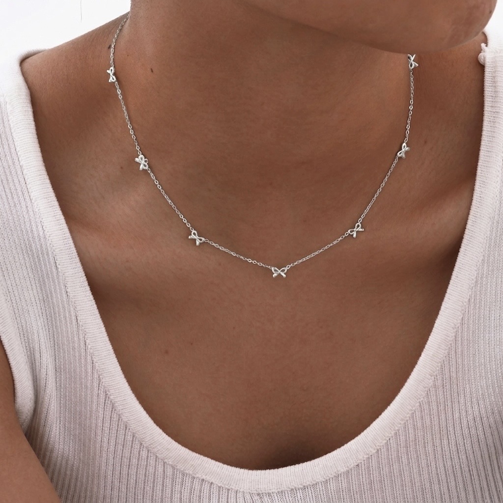 Silver Bow Charm Station Necklace